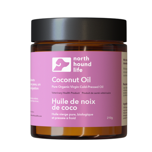 Jar of coconut oil with a pink label on a white background, in amber glass jar with black lid
