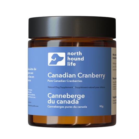 Jar of North Hound Life Canadian Cranberry supplement on a white background, with blue digestive health label on amber glass jar with black lid