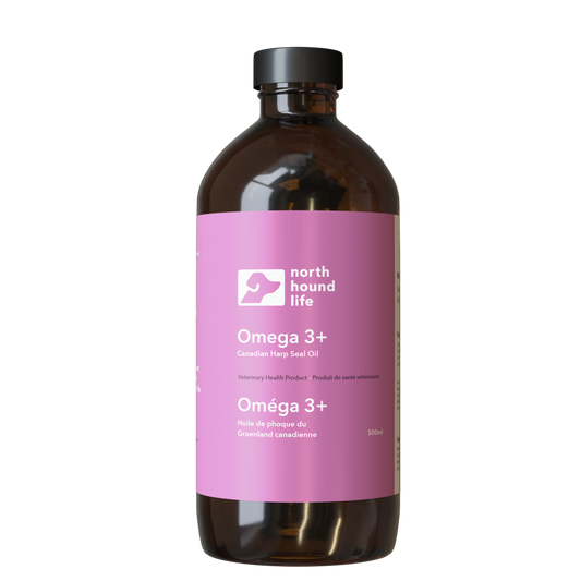 Omega 3 + supplement for dogs in amber bottle with matt black top, wrapped in pale pink label with white text and white dog silhouette image