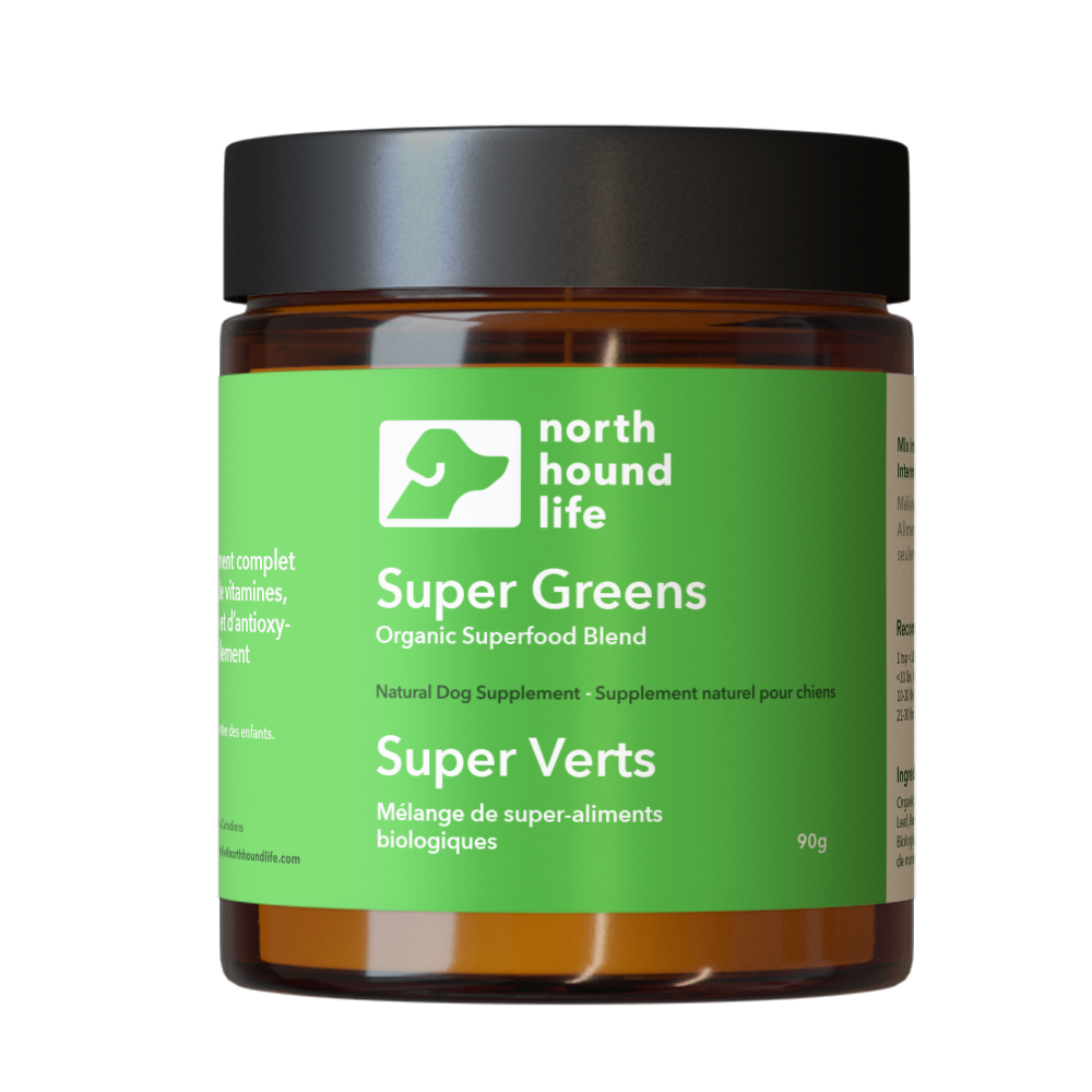 Super Greens supplement for dogs in amber glass jar with matt black cap, jar is wrapped in vibrant green label with white and black text and white silhouette image of a dog
