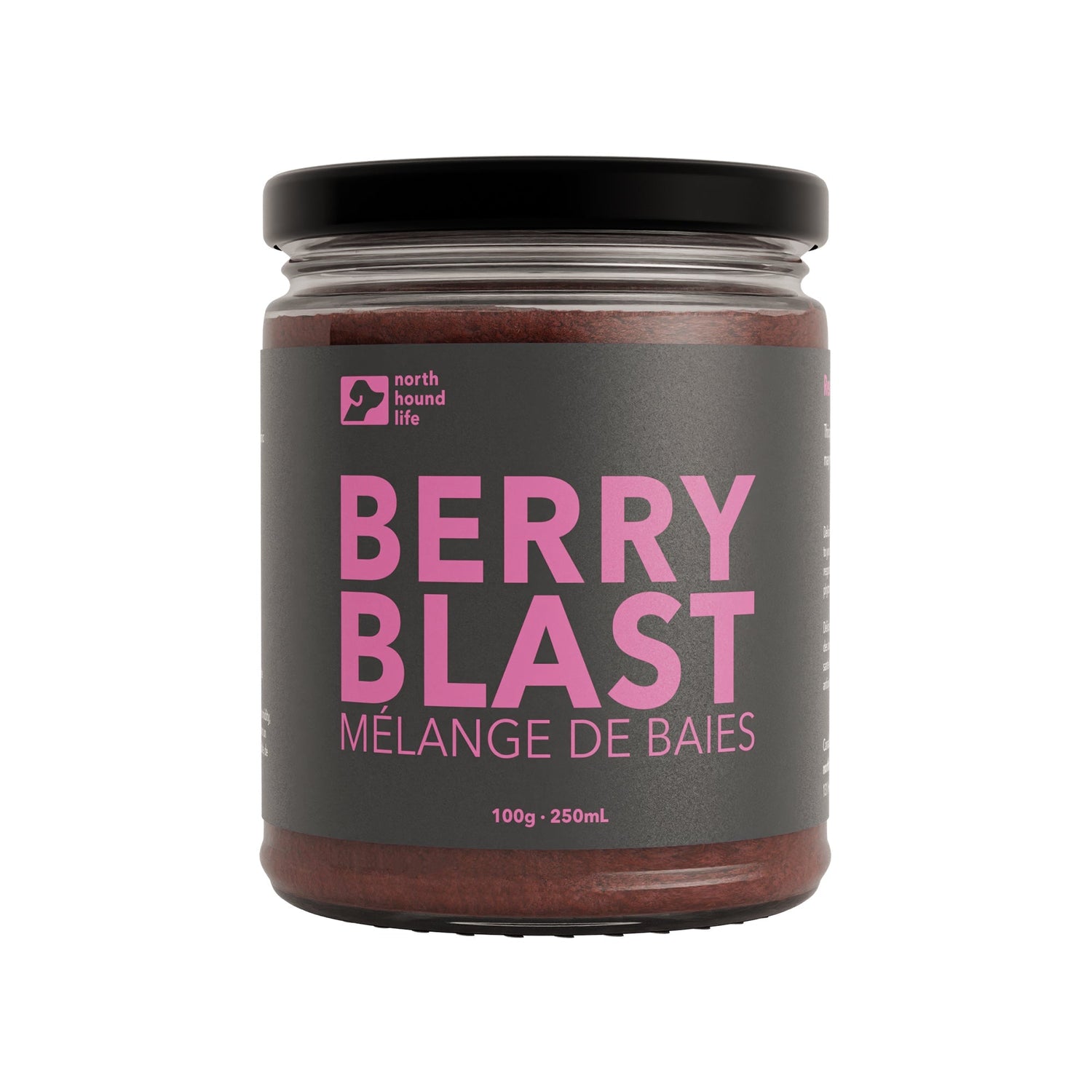 A recyclable glass jar labeled 'Berry Blast' containing a fruit-based superfood blend for dogs.